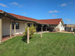 Exterior courtyard and lawn area of North STAR 2 with a covered walkway.